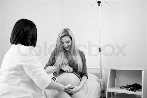 Pregnant Woman Having Ultrasonic Scanning At The Clinic Stock Image