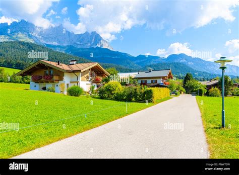 Road In Going Am Wilden Kaiser Mountain Village On Sunny Summer Day And