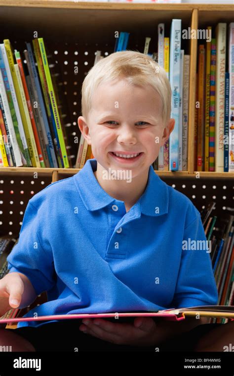 Little Boy Reading A Book Stock Photo Alamy