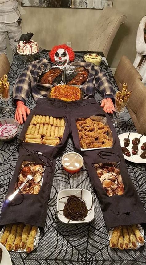 A Table Filled With Lots Of Food On Top Of A Dining Room Table Covered