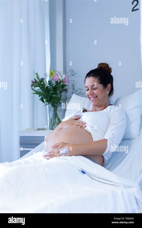 Pregnant Woman Touching Her Belly In The Ward Stock Photo Alamy