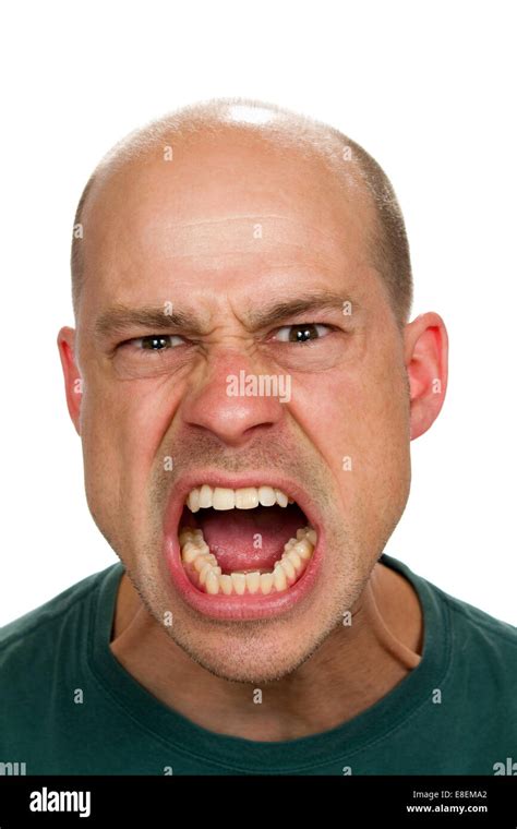 Angry And Mad Man Screams With His Mouth Wide Open Showing His Rage