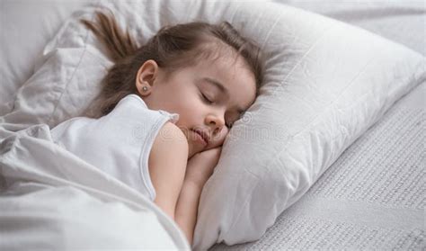 Cute Little Girl Sleeps Sweetly In Bed Stock Image Image Of Happy