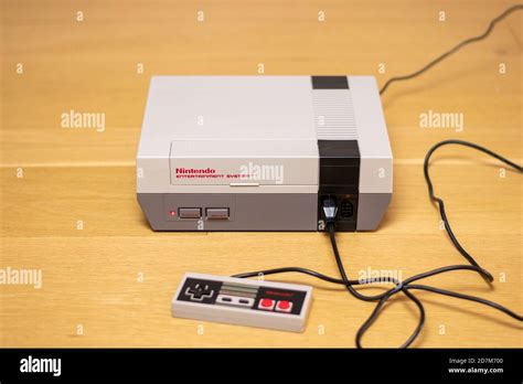 A Nintendo Entertainment System With A Controller Plugged In The Nes