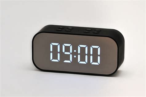 Electronic Clock With Digital Indication Of Time And Date On A White
