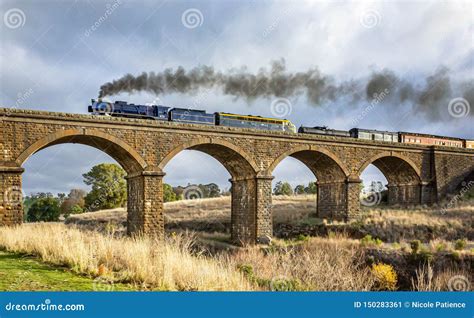 Old Fashioned Steam Train Crossing A Historic Bluestone Masonry Bridge