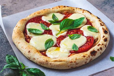 Classic Neopolitan Margherita Pizza With Tomatoes Mozzarella And Basil