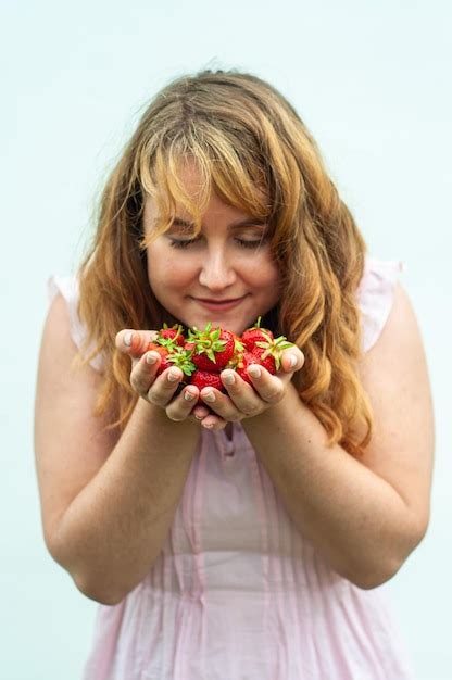 premium photo sweet red strawberry in the hands of a girl tasty berry vitamins diet fruit farm