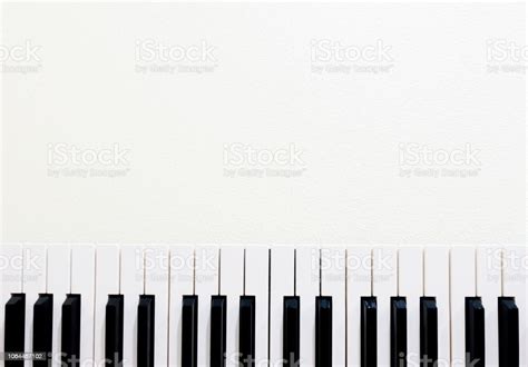 Black And White Piano Keys On White Texture Background Stock Photo