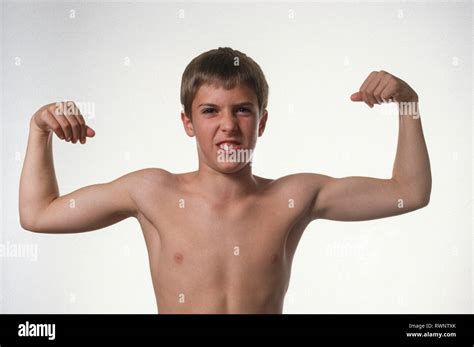 Young Boy Flexs His Muscles Usa Stock Photo Alamy
