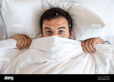 Man Hiding Under Duvet Hi Res Stock Photography And Images Alamy