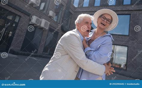 mature woman and older man enjoying a walk in the city stock image image of married couple