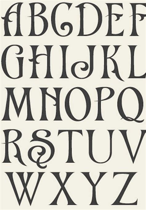 An Old Fashioned Font With The Letters In Black And White On A Beige