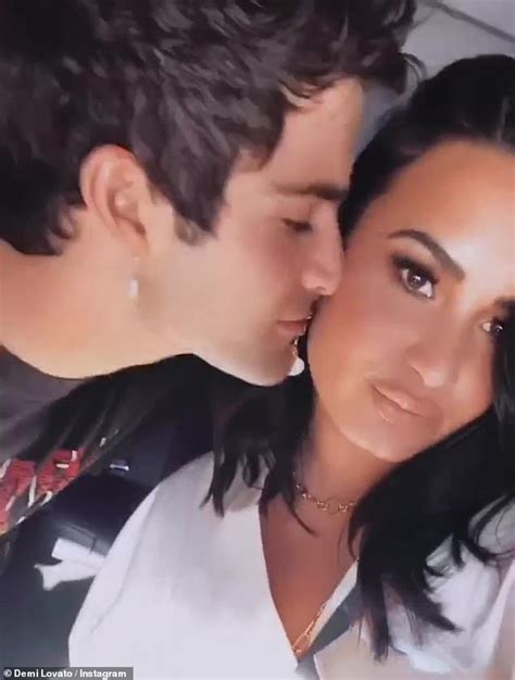 Demi Lovato Shares A Smooch With Fiancé Max Ehrich After He Kisses Her
