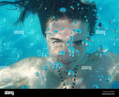 Close Up Of Woman Underwater In Swimming Pool Stock Photo Alamy