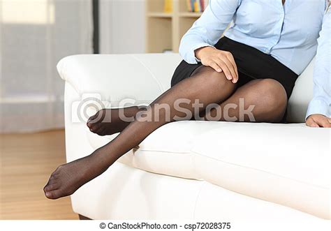 Businesswoman Legs With Nylons Posing On A Couch Businesswoman Legs