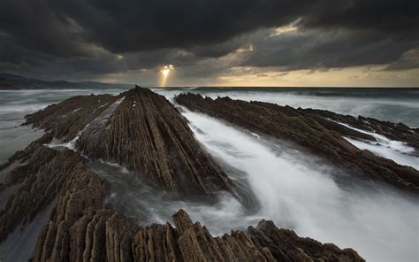 Sunlight Clouds Rocks Stones Ocean Hd Wallpaper Nature And Landscape