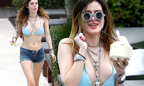 Bella Thorne Dons A Blue Bikini Top And Denim Shorts To Lounge By The
