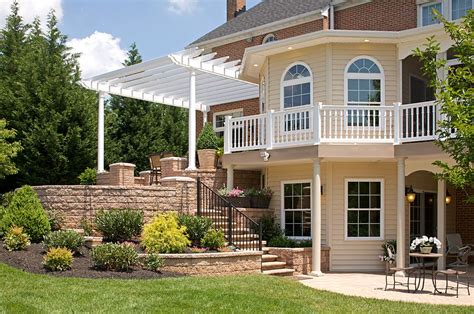 Cantilevered seating nooks, a cedar pergola for shade, detailed horizontal railings, and cascading stairs, to name a few. Two story addition with wrap around porch, patio with ...