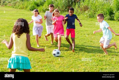 Barefoot Kids Playing Football Hi Res Stock Photography And Images Alamy