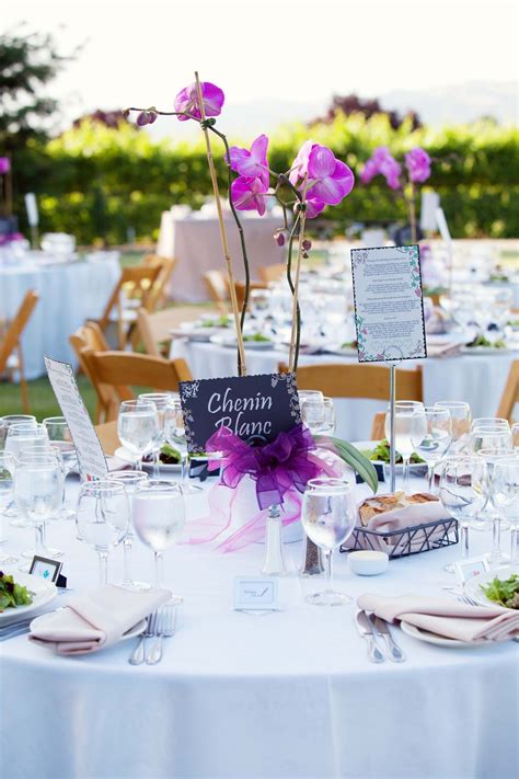 Beautifully set table for an outdoor wedding reception. | Simple