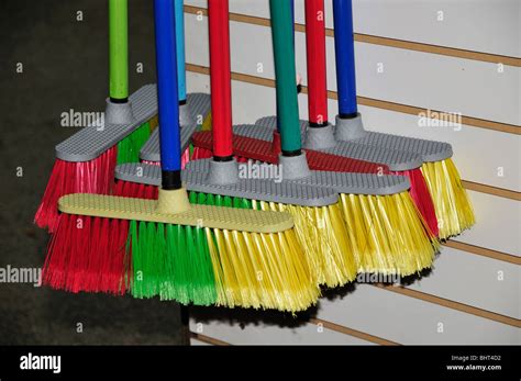 Colorful Brooms Displayed In A Florida Flea Market Stock Photo Alamy