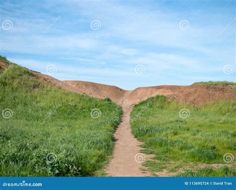 Path In Grassy Field Leading To A Dirt Hill Stock Photo Image Of