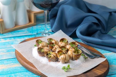 Premium Photo Baked Snails With Garlic Butter And Fresh Herbs