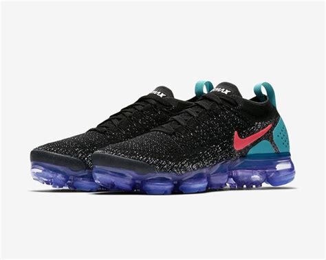 A reflective strip appears on the heel. Nike Air VaporMax Flyknit 2 Black Dusty Cactus Hot Punch ...