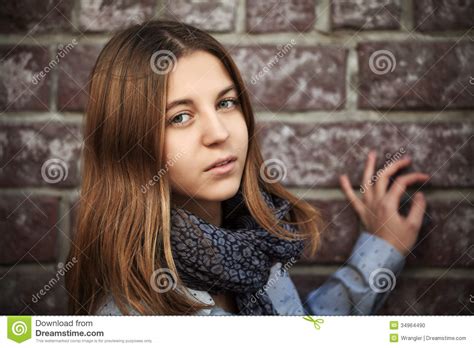 Sad Fashion Teen Girl Against A Brick Wall Stock Photo Image Of