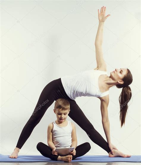Mother And Son Doing Yoga Sports Exercises Have Fun And Spend A Good Time Together Isolated
