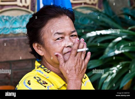 A Thai Woman Smoking A Cigarette Stock Photo Alamy