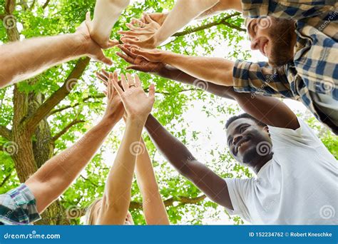 Group Of Friends Makes High Five Support Stock Photo Image Of Outside