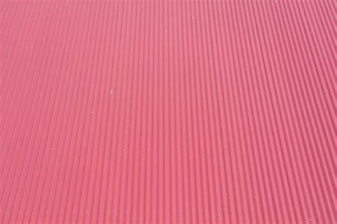 Aerial View Of Burgundy Coloured Corrugated Iron Roof Panels Stock