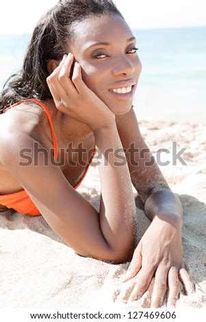 Close Up Portrait Of A Beautiful African American Woman Sunbathing