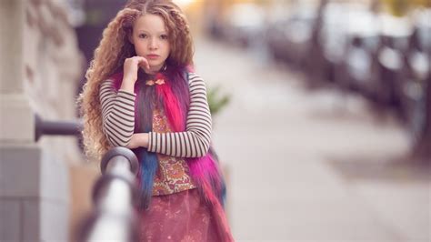 Curly Hair Cute Little Girl Is Wearing Colorful Dress