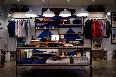 Racks With Mens Apparel On The Walls Of A Clothes Store Store