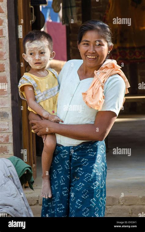 Burmese Village Life Woman With Toddler On Her Hip Stock Photo Alamy