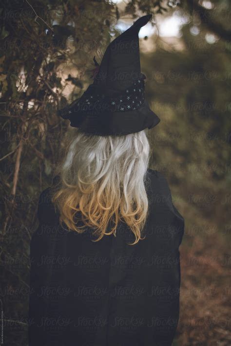 Girl Wearing Witch Costume At Halloween In The Forest By Stocksy Contributor Beatrix Boros