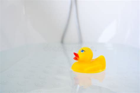 Yellow Playful Rubber Duck Float In The Bathtub Kids Bath Time Concept