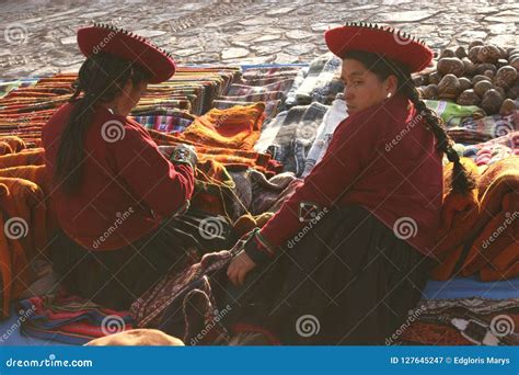 Indigenous Inca Woman Working With Textils In The Chinchero Market