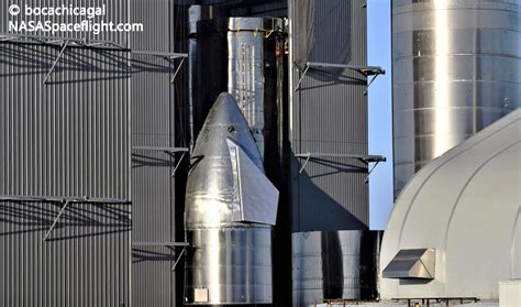 Sn11 nosecone stacking in the high bay. SpaceX rolls last Starship off the assembly line ahead of ...