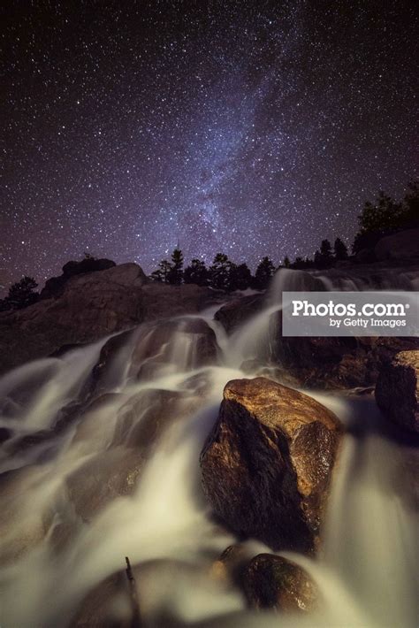 Capturing A Starry Night Waterfall In Rocky Mounta Print By Mike