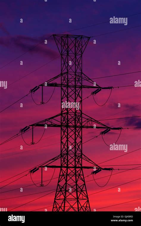 Electricity Pylons In The Sunset Stock Photo Alamy