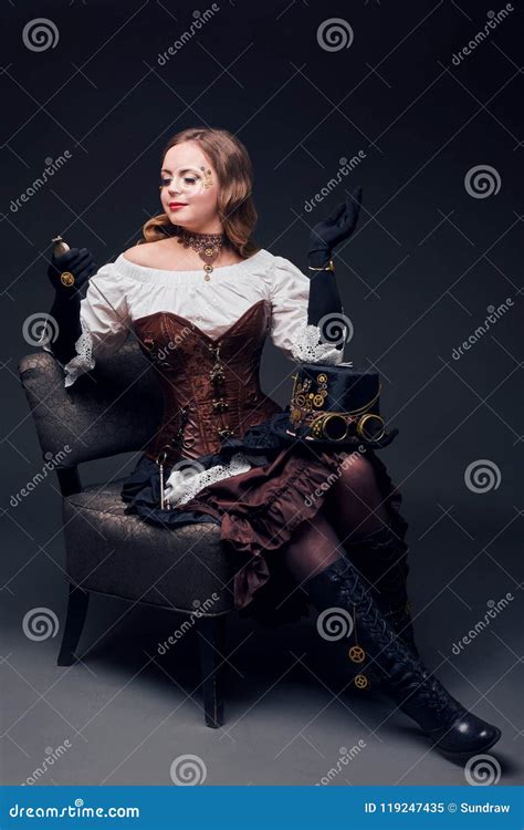 Beautiful Woman In Steampunk Style Sitting On The Chair Stock Image