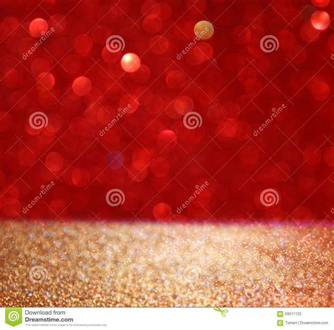 Abstract Background Of Red And Gold Glitter Bokeh Lights