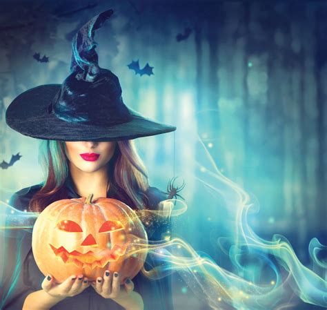 46883589 Halloween Witch With A Magic Pumpkin In A Dark Forest Stone Creek Insurance Agency