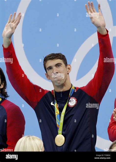 Michael Phelps Of The United States Holds His Gold Medal After The Mens 4 X 100m Medley Relay