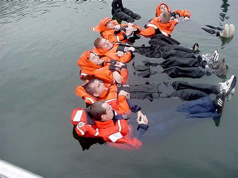 Us Coast Guard Members Practice Cold Water Survival By Grouping
