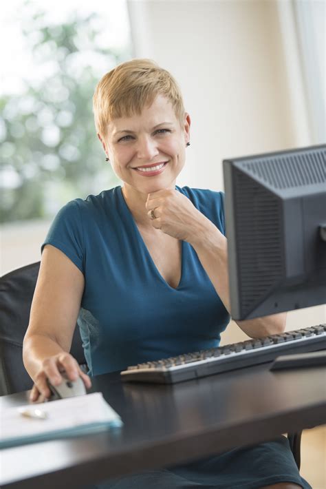 Businesswoman Sitting At Computer Desk Linkedin Mentoring